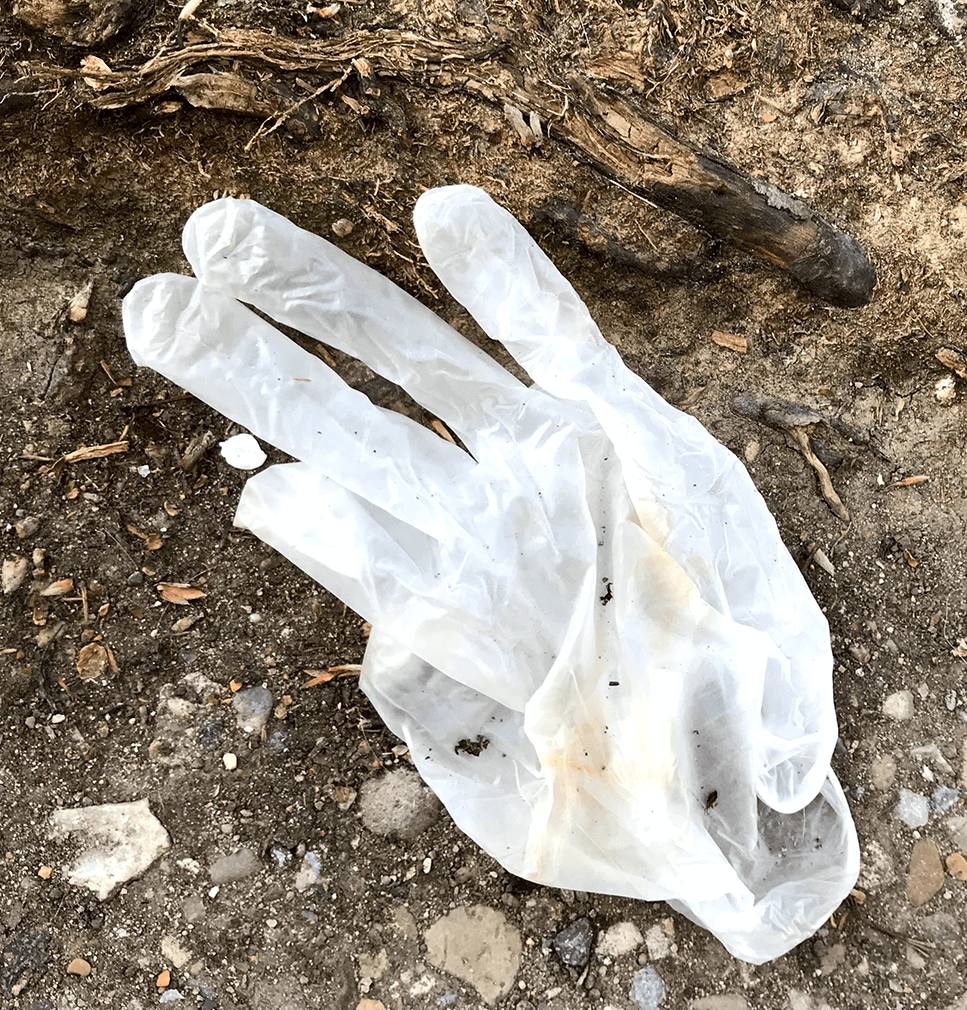 White Disposable Glove on Ground